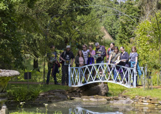 Group On The Bridge In Swiss Garden. © The Shuttleworth Trust. Photo Darren Harbar